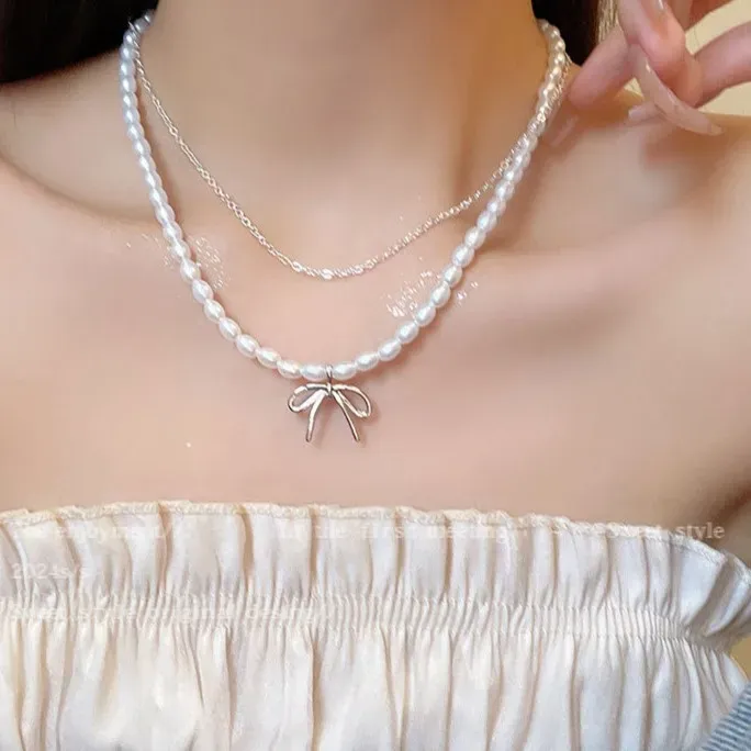 Imitation Layered Pearl Necklace And Bow Detail - Image 1