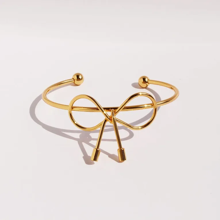 Imitation Trendy Gold-Plated Cuff Bracelet With Bow Detail - Image 1