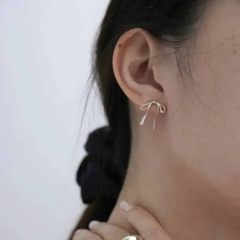 Imitation Silver Bow Stud Earrings - Image 1