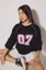 Black Oversized Raglan Sleeve Printed Tshirt