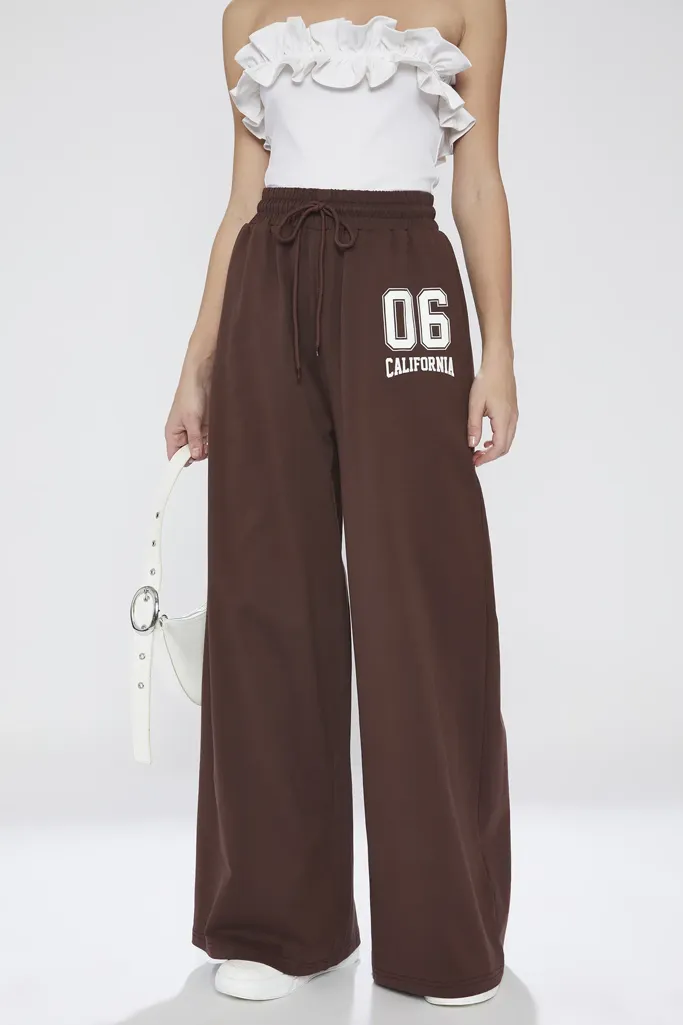 Brown Typography Mid Rise Pants - Image 1