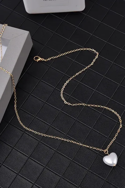 Golden Heart Sunburst Necklace - Image 1