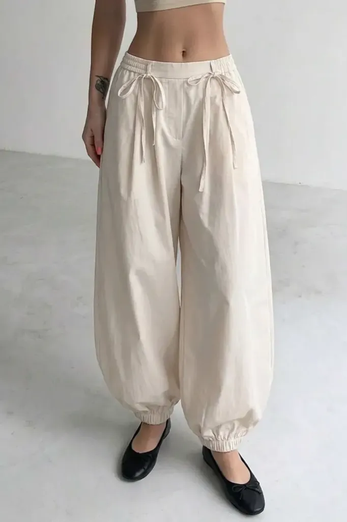 Off White Solid Mid Rise Trousers - Image 1