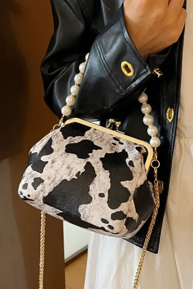 Beige Cow Print Pearl Clutch - Image 1